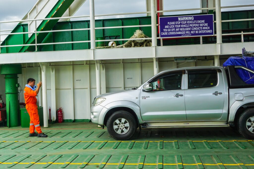 A person providing parking directions to ensure proper placement of vehicles