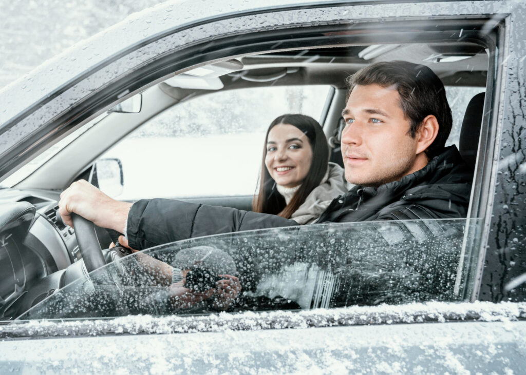 side-view-couple-car-while-road-trip